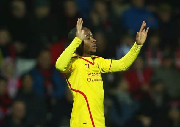 Twogoal Raheem Sterling celebrates after scoring Liverpools opener against Bournemouth. Picture: Getty