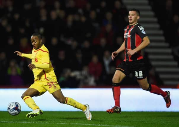 Baily Cargill keeps a close eye on Liverpool's Raheem Sterling. Picture: Getty