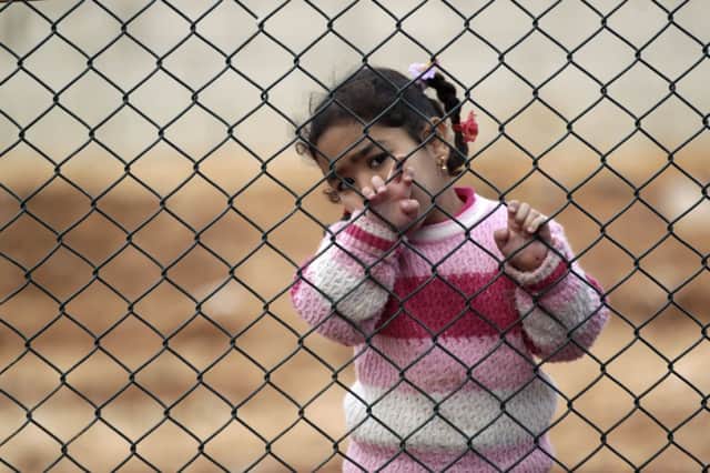Refugee camps, such as the one left at Qtma on the Turkish-Syrian border, have sprung up. Picture: Reuters