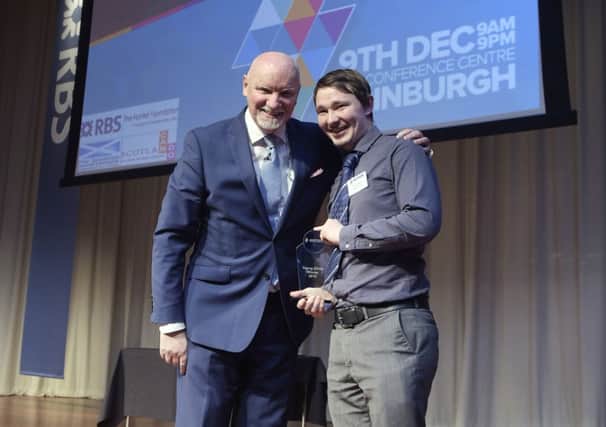 Gregor collects his YoungEdge award from Sir Tom Hunter. Picture: Sandy Young
