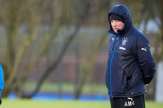 A reflective Ally McCoist supervises Rangers training yesterday ahead of todays home encounter with Livingston. Picture: SNS