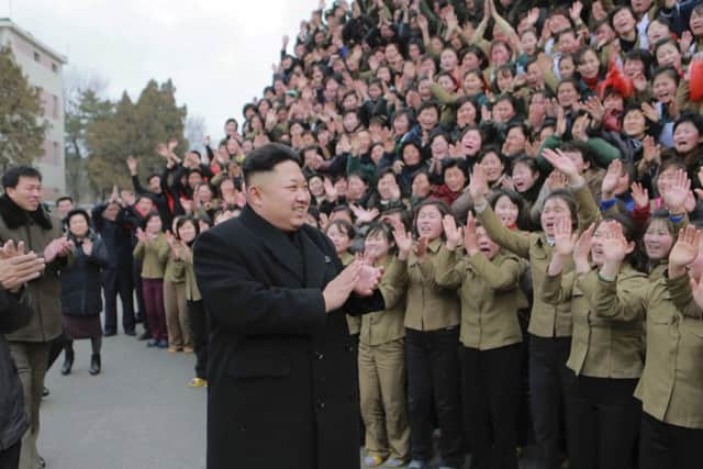Kim Jong Un smiles as he gives field guidance at the Kim Jong Suk Pyongyang Textile Mill. Picture: Reuters