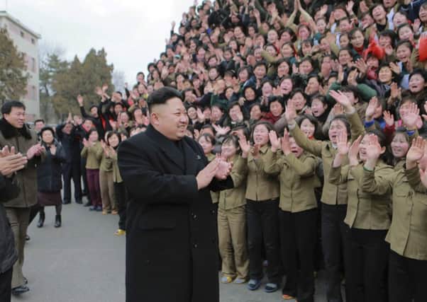 Kim Jong Un smiles as he gives field guidance at the Kim Jong Suk Pyongyang Textile Mill. Picture: Reuters