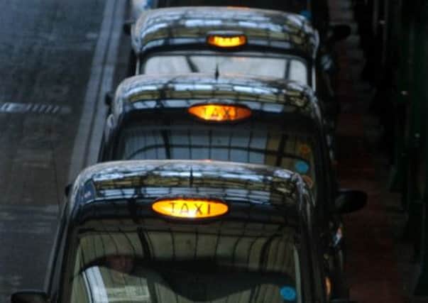 Black cab drivers should give priority to women travelling alone at night, an MSP has said. Picture: Neil Hanna