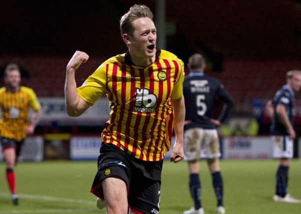 Stuart Craigen punches the air in delight after scoring for Partick Thistle - but the Jags were undone by a late own goal. Picture: SNS