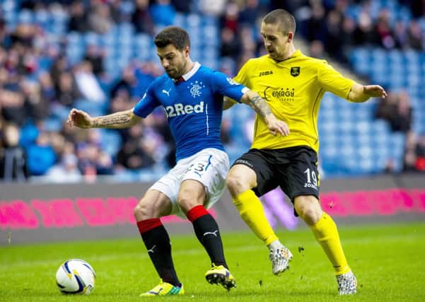 Rangers' Richard Foster (left) is closed down by Gary Glen. Picture: SNS