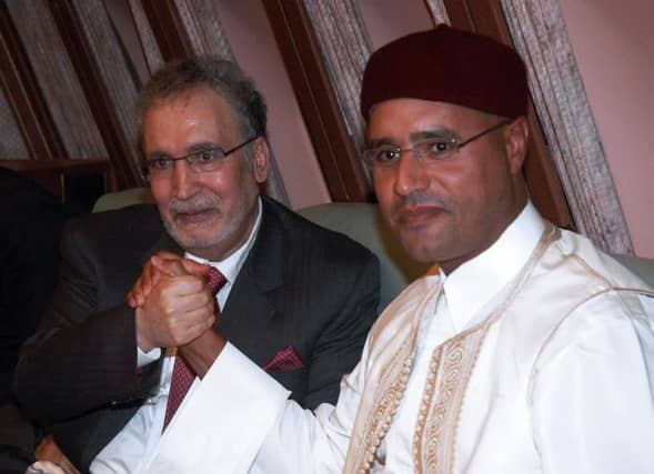 Moamer Kadhafi's son Seif al-Islam (R) with Lockerbie bomber Abdelbaset Ali Mohmet al-Megrahi. Picture: AFP
