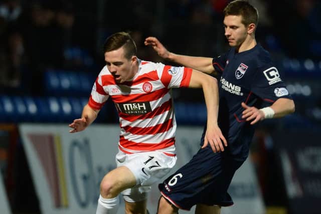 Hamilton's Louis Longridge (left) runs from Ross County's Steven Saunders. Picture: SNS