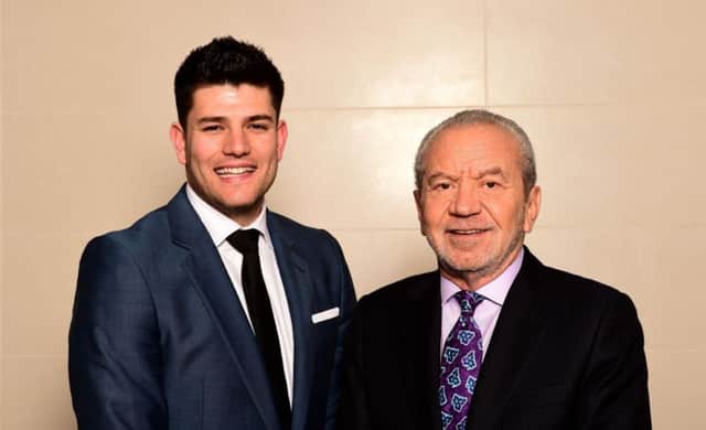 Series winner Mark Wright, 25, celebrates with Lord Sugar. Picture: PA