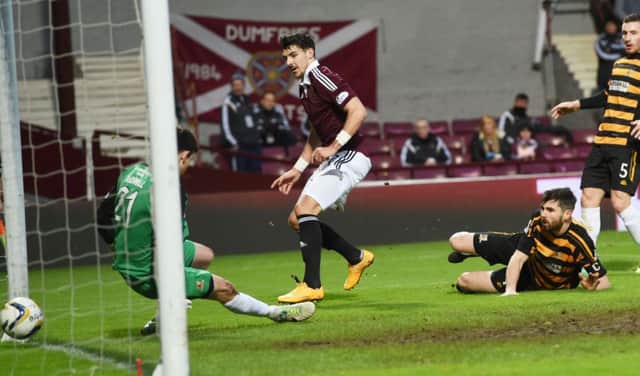 Callum Paterson gets into the danger area to steer Hearts second goal beyond Alloa goalkeeper Craig McDowall. Picture: SNS