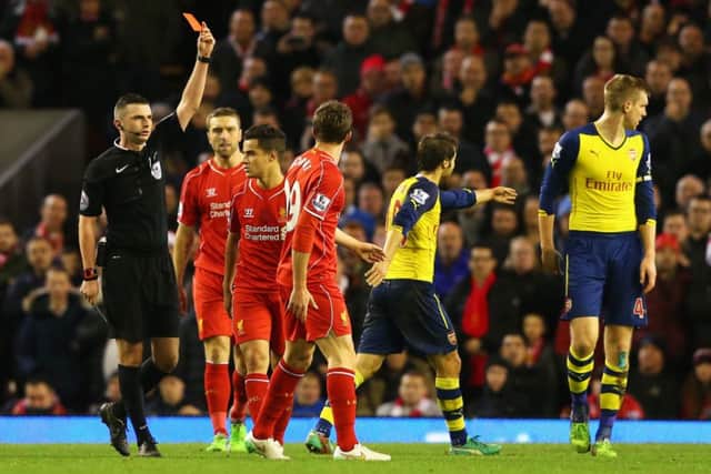 Fabio Borini of Liverpool is shown the red card by referee Michael Oliver. Picture: Getty