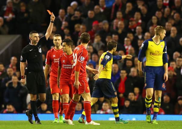 Fabio Borini of Liverpool is shown the red card by referee Michael Oliver. Picture: Getty