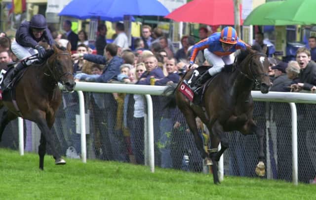 High Chaparral, right, ridden by Johnny Murtagh, wins the 2002 Derby, from Hawk Wing. Picture: PA