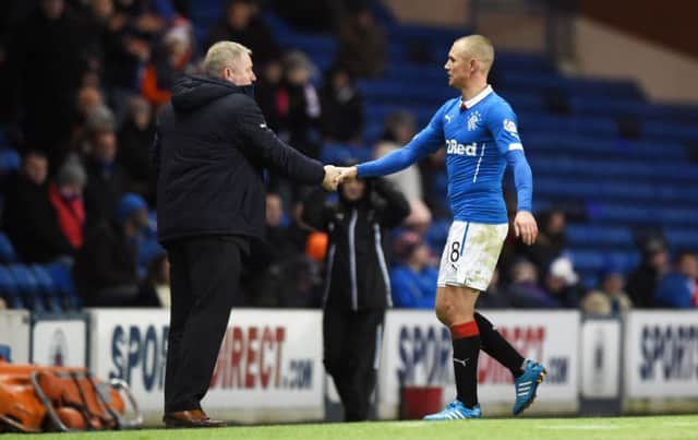 Rangers striker Kenny Miller shakes hands with Ally McCoist in what would go down as the managers last game. Picture: SNS