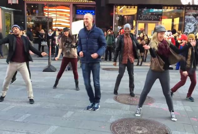 Sean shows off his dance moves in Times Square. Picture: Contributed