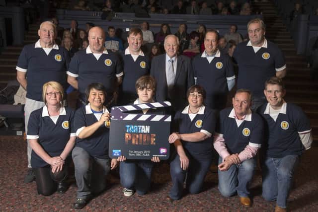 Craig Brown lined up alongside a team of Scotland fans to launch the BBC Alba documentary Tartan Pride yesterday. Picture: Jeff Holmes