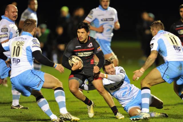 Edinburgh stand-off, on trial New Zealander Jade Te Rure, is surrounded and tackled by Glasgows Ali Price. Picture: Ian Rutherford