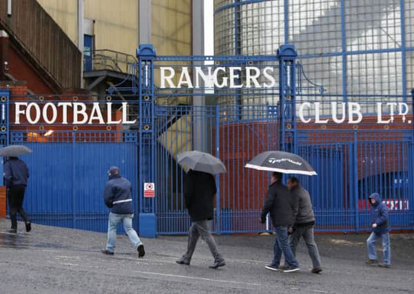 Shareholders arrive to attend the Rangers AGM at Ibrox Stadium yesterday. Picture: PA