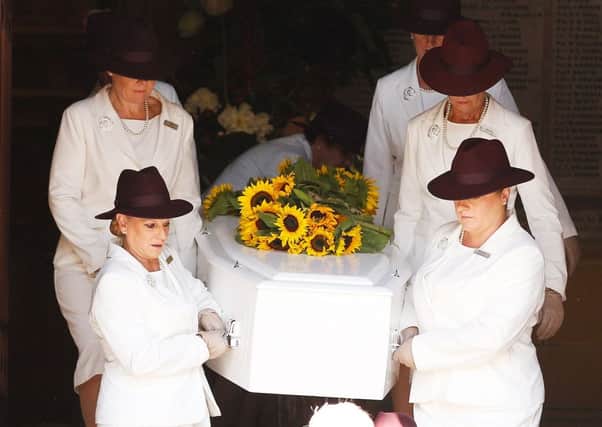 Shooting victim Tori Johnsons  coffin is carried from the service, which was attended by New South Wales premier Mike Baird. Picture: Getty