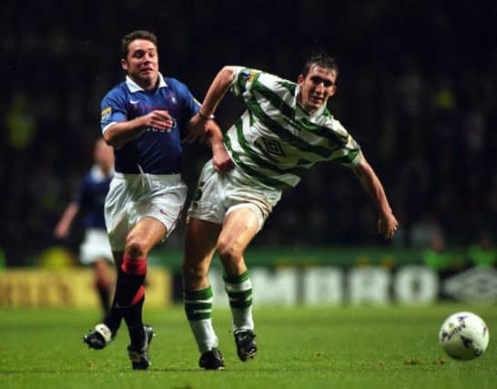 Alan Stubbs holds off sparring partner and occasional drinking buddy Ally McCoist during an Old Firm game in 1997. Picture: SNS