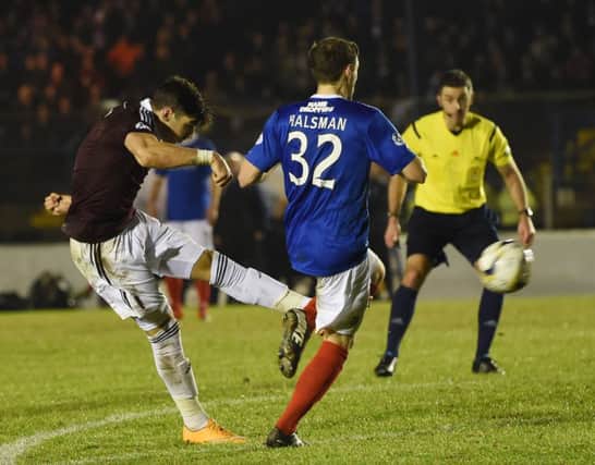 Callum Paterson lashes home a superb leftfooted volley to score Hearts' second goal. Picture: SNS