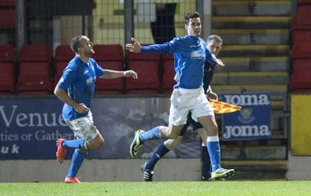 Brian Graham (right) celebrates putting his side in the lead against Inverness. Picture: SNS