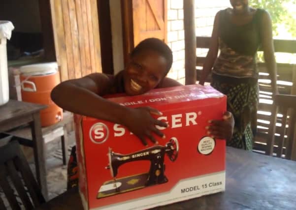 Malawi teenager Susan Banda receives her gift. Picture: Contributed