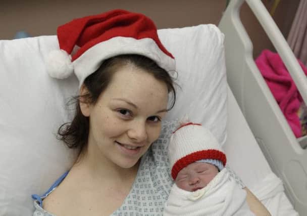 Admin and accounts administrator Samantha Lyon, 21, from Bellahouston, Scotland, with her new born baby boy. Picture: Hemedia