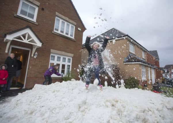 White Christmas arrived at the Provan family as snow was delivered to the home of youngsters Olivia Provan, six - and more is on the way, according to forecasters. Picture: Jeff Holmes/JSHPix.com