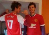 Andy (L) and Jamie in their new replica kits of Arsenal and Manchester United, respectively. Picture: Contributed