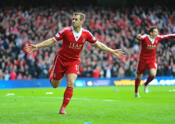 Niall McGinn is used to celebrating more for Aberdeen. Picture: TSPL
