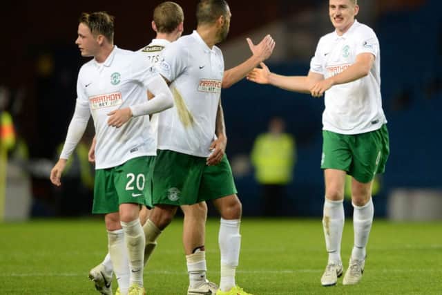 Paul Hanlon, right, leads the celebrations following Hibs 3-1 victory over Rangers at Ibrox in September. Picture: SNS