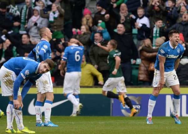 The Rangers players struggle to control their emotions as they concede again. Picture: SNS