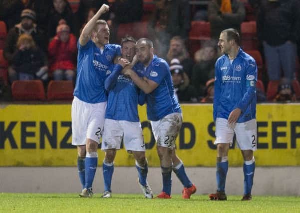 St Johnstone's Chris Millar (2nd from left) celebrates after giving his side the late winner. Picture: SNS