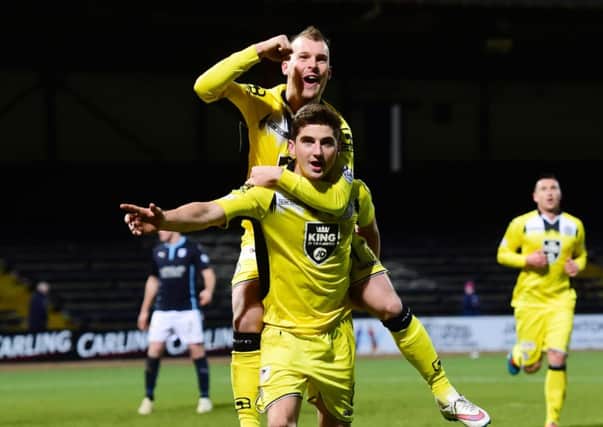 Kenny McLean celebrates his penalty with St Mirren team-mate Greg Wylde (top). Picture: SNS