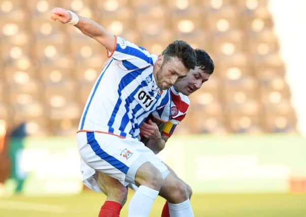 Kilmarnock's Lee Miller holds off Martin Canning (right). Picture: SNS