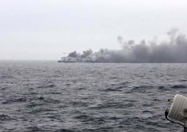 In this photo taken from a nearby ship, smoke rises from the Italian-flagged Norman Atlantic after it caught fire in the Adriatic Sea. Picture: AP