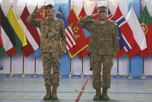 Generals John Campbell, right, and Hans-Lothar Domrose at the ceremony in Kabul. Picture: AP