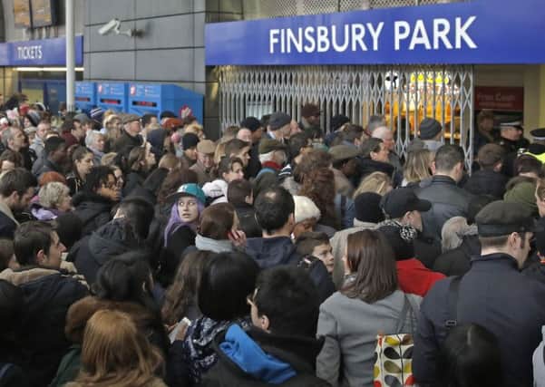 Crowds of passengers queue outside Finsbury Park Station in north London. Picture: Reuters
