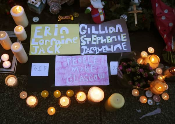 Many of those in the crowd held lit candles as they reflected on the six people who were killed and 10 injured. Picture: PA