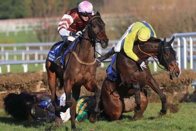 Tony McCoy and Shane Shortall fall from their mounts Speckled Wood and Elishpour at Leopardstown. Picture: PA