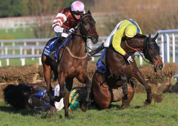 Tony McCoy and Shane Shortall fall from their mounts Speckled Wood and Elishpour at Leopardstown. Picture: PA
