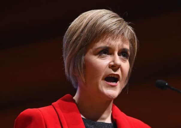First Minister Nicola Sturgeon is neither a communist nor a caped crusader  but shell be called worse. Picture: Getty