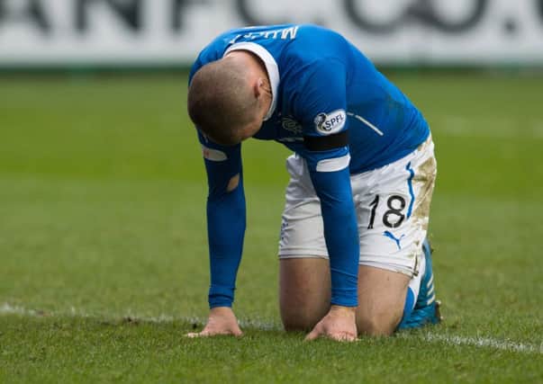 Rangers striker Kenny Miller on his knees after a chance went begging against Hibs. Picture: SNS