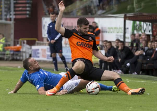 Dundee United's Nadir Ciftci is felled by St Johnstone's Lee Croft during the recent meeting between the two sides. Picture: SNS