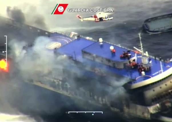 In this image taken from a video released by the Italian Coast Guard, smoke billows from the Italian-flagged Norman Atlantic. Picture: AP