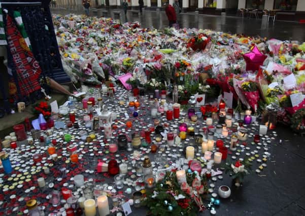 People are still laying floral tributes for the victims of the bin lorry crash one week ago at Princes Square in Glasgow. Picture: Hemedia