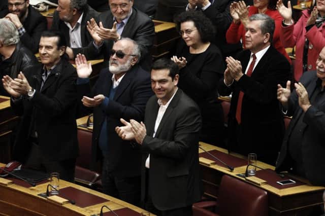 Alexis Tsipras and his politicians applaud after the last round of the presidential vote. Picture: Reuters