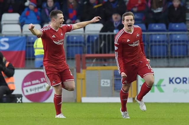 Peter Pawlett charges off to celebrate his goal with Ryan Jack (left). But can the Dons mount a title challenge? Picture: SNS