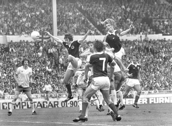 Gordon McQueen rises highest to power a header into the England net. Picture: Dennis Straughan